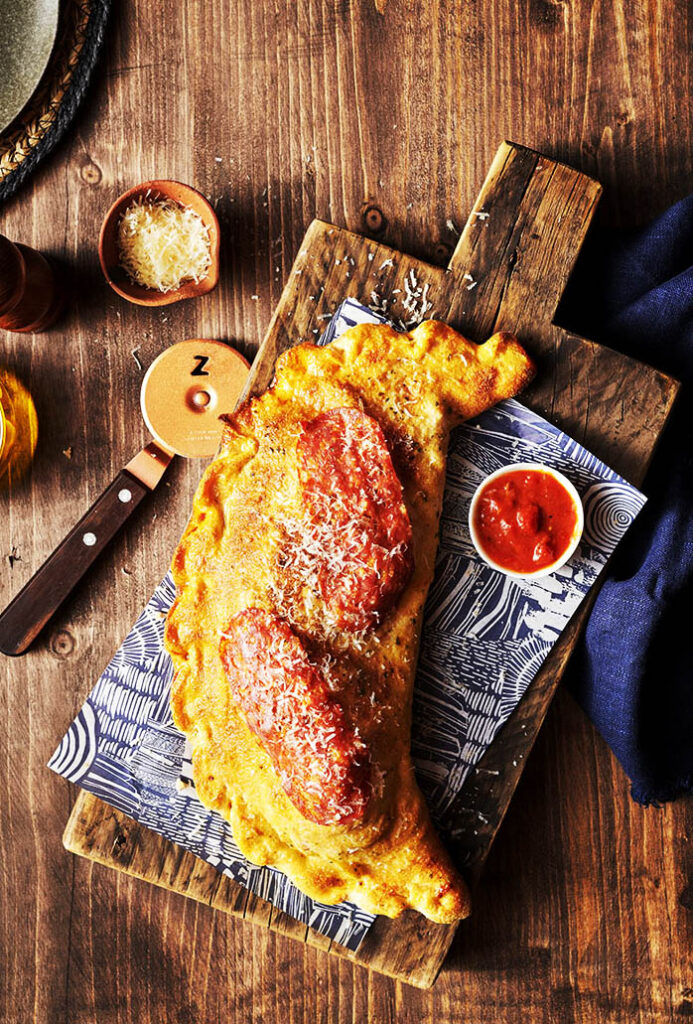 Food and drink photography of Calzone, pizza dough, restaurant photography, photographed in Sussex by a food photographer working with London clients